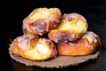 Tasty cookies poured with liqueur on a gray napkin. Dessert prepared to be served on the kitchen table.