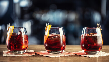 Negroni classic cocktail and gin short drink with sweet vermouth, red bitter liqueur and dried...