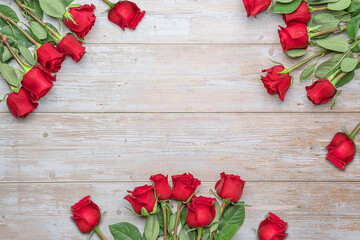 Bouquets of red roses around on wooden wall. Layout for postcards, invitations for Valentine's Day 14 february, Engagement, wedding anniversary, Birthday  preparation.