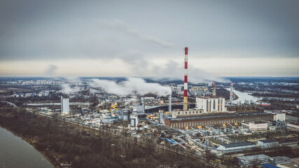 Naklejka premium heat and power plant under dark cloudy sky