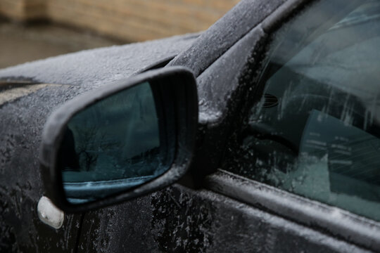 Close up image of a car on a cold frozen winter morning.
