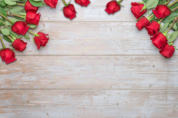 Red roses in bouquets, wooden surface for postcards, invitations for Valentine's Day 14 february, Engagement, wedding anniversary, romantic evening  preparation.