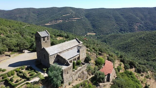 Drone view of medieval Serrabone Priory, former monastery of Canons Regular in valley of Boules at centre of Aspres mountain range, France