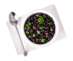 Dark red canned beans in white bowl