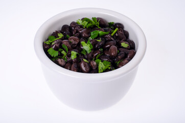 Dark red canned beans in white bowl