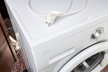 laundry washing machine repair concept. handyman fix washing appliance