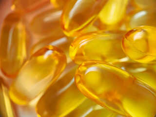 Close-up texture of many omega 3 capsules. Polyunsaturated fatty acids. The concept of a healthy...