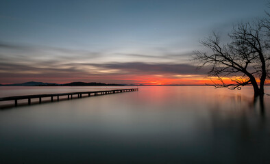 Naklejka na ściany i meble Scenic View Of Lake Against Sky At Sunset