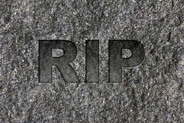 RIP etched in bold, dark gray text on black granite.