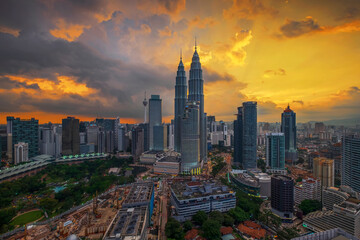 Fototapeta na wymiar Aerial View Of Buildings Against Cloudy Sky During Sunset