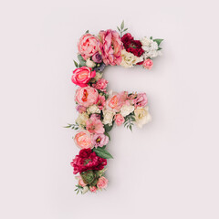 Letter F made of real natural flowers and leaves. Flower font concept. Unique collection of letters...