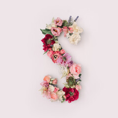 Letter S made of real natural flowers and leaves. Flower font concept. Unique collection of letters...