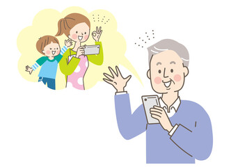 スマホで娘と孫と通話するシニア男性
