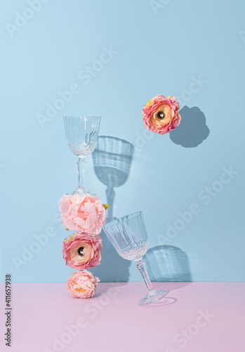 Creative natural minimal flat lay layout with flowers and champagne glasses. Mother's day or Valentines concept background design.