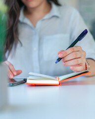 woman writing on paper