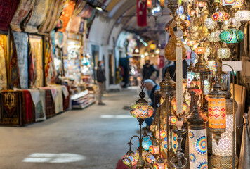 Shopping in the Grand Bazar. Traditional Turkish lamps in souvenir shop. Handmade mosaic of colored glass in Grand Bazaar.