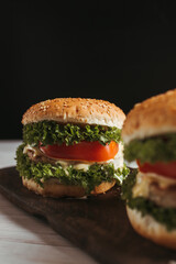 Close-up home made hamburgers on wooden plate