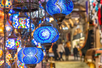 Shopping in the Grand Bazar. Traditional Turkish lamps in souvenir shop. Handmade mosaic of colored glass in Grand Bazaar.