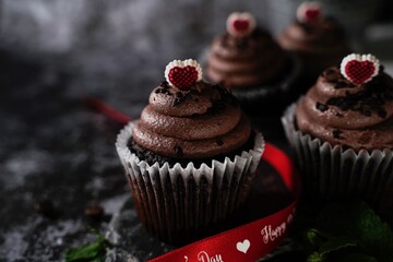 Valentines day Chocolate Cupcakes on dark moody setting, selective focus