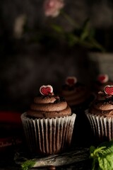 Valentines day Chocolate Cupcakes on dark moody setting, selective focus