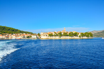 Fototapeta premium View from the Adriatic sea of the island of Korcula, Croatia, on the Dalmatian Coast on a sunny summer day.
