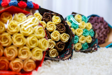 Beautiful bouquet of different flowers close up made of chocolate, edible sweet flower bouquet, original gift
