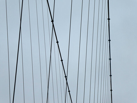 Low Angle View Of Suspension Bridge Against Clear Sky
