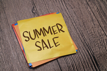 Summer sale, text words typography written on paper against wooden background, life and business motivational inspirational