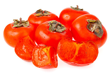 Heap of ripe sweet orange persimmons isolated on white background. Studio Photo