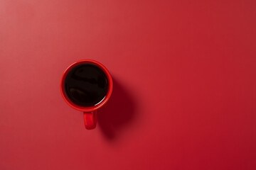 Red coffee cup on red background top view. Minimal. Chinese concept.