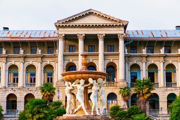 Abandoned sanatorium Ordzhonikidze in Sochi. Tall columns, sculptures with vegetation and palm...