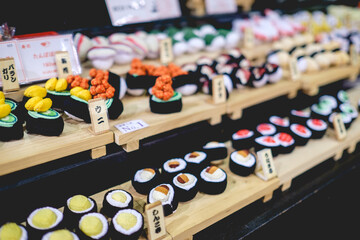 Traditional craft cotton toy with form of sushi rolls at store in Nishiki Market, Kyoto, Japan