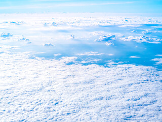 Naklejka na ściany i meble Above the cloud, sky view from airplane window.