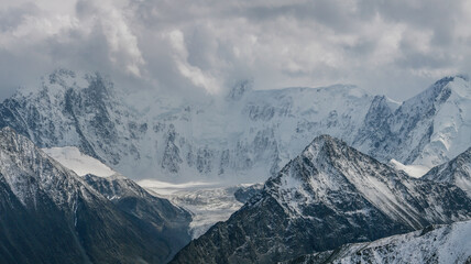 Mountain view. Peaks in the clouds.
