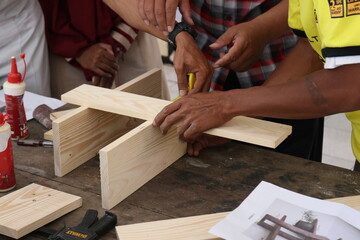 carpenter measuring wood