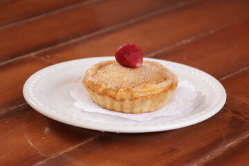 Plate with a personal cake with a strawberry