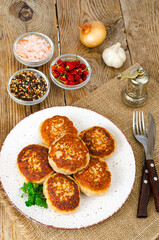 Homemade meat cutlets on wooden table. Studio Photo