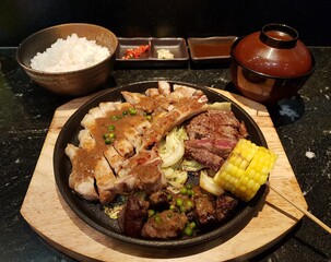 Japanese mixed steak set with rice and soup.