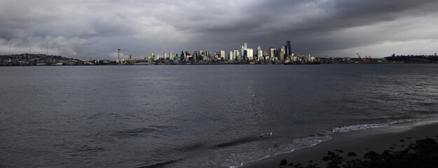 View of the city of Seattle over the Puget sound as seen from Alki Beach in West Seattle