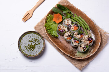 Suan Noodle with chicken and vegetables in a plate on a white background.