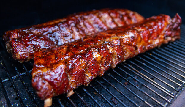 Babyback pork ribs cooking on a pellet grill smoker