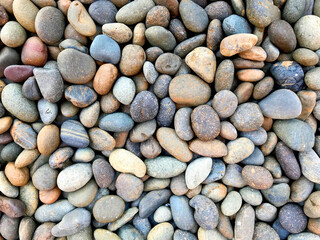 Colorful stones background top view for natural concept