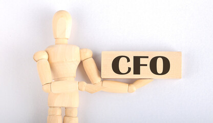 Wooden man shows with a hand to block with text CFO
