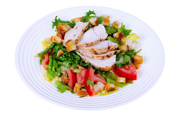 Home kitchen. Vegetable salad with chicken and croutons. Caesar. Studio Photo