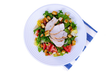 Home kitchen. Vegetable salad with chicken and croutons. Caesar. Studio Photo