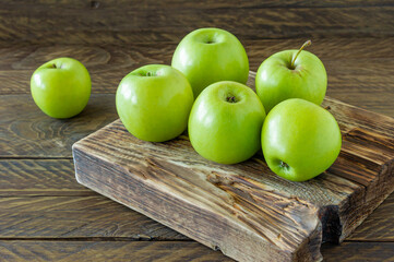 Green ripe apples on wooden desk. Rustic style. eco-friendly farming. sustainable food