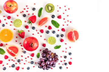 Fresh summer fruit, a flat lay on a white background, vibrant food pattern, overhead shot with a place for text