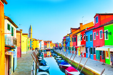 Colorful houses on the canal in Burano island, Venice, Italy. Famous travel destination. 