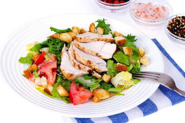 Home kitchen. Vegetable salad with chicken and croutons. Caesar. Studio Photo