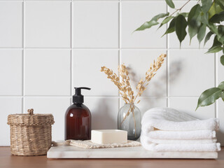 White bath background front view with cosmetic bottle and bath accessories